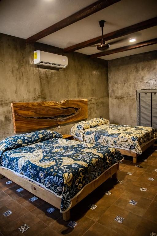 Habitación con dos camas matrimoniales